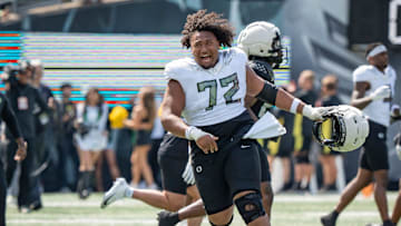 Fighting Ducks offensive lineman Iapani Laloulu celebrates as the Fighting Ducks face off against Mighty Oregon in the Oregon Ducks spring game on April 26, 2025, at Autzen Stadium in Eugene.