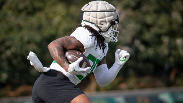 Oregon running back Jordan James carries the ball during practice with the Ducks 