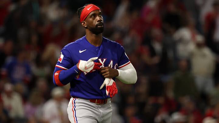 May 23, 2026; Anaheim, California, USA;  Texas Rangers pinch hitter Andrew McCutchen (4) reacts after strike out during the seventh inning against the Los Angeles Angels at Angel Stadium. Mandatory Credit: Kiyoshi Mio-Imagn Images
