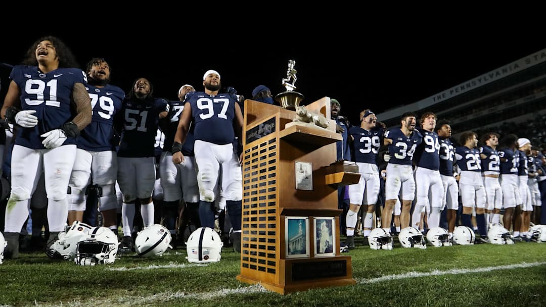 A detailed view of the Land Grant Trophy as the Penn State Nittany Lion players sing their alma mater after beating the Michigan State Spartans at Beaver Stadium.