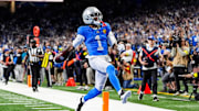 Detroit Lions wide receiver Jameson Williams (1) runs for a touchdown against Green Bay Packers during the first half at Ford Field in Detroit on Thursday, Nov. 27, 2025.