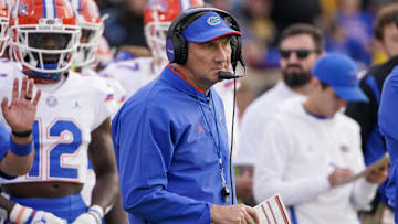 Nov 20, 2021; Columbia, Missouri, USA; Florida Gators head coach Dan Mullen watches play against the Missouri Tigers during the first half at Faurot Field at Memorial Stadium. Mandatory Credit: Denny Medley-Imagn Images