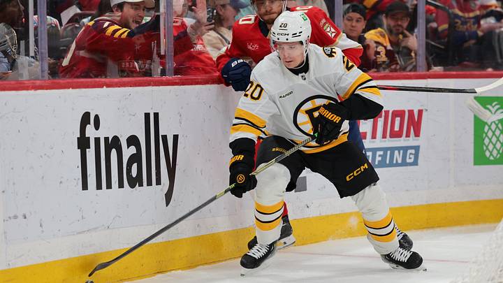Apr 2, 2026; Sunrise, Florida, USA; Boston Bruins defenseman Henri Jokiharju (20) moves the puck against Florida Panthers left wing A.J. Greer (10) during the first period at Amerant Bank Arena. Mandatory Credit: Sam Navarro-Imagn Images Apr 2, 2026; Sunrise, Florida, USA; Boston Bruins defenseman Henri Jokiharju (20) moves the puck against Florida Panthers left wing A.J. Greer (10) during the first period at Amerant Bank Arena. Mandatory Credit: Sam Navarro-Imagn Images