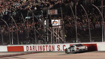 Sep 1, 2024; Darlington, South Carolina, USA; NASCAR Cup Series driver Chase Briscoe (14) crosses the start/finish line to win the Cook Out Southern 500 at Darlington Raceway.