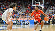 Mar 16, 2023; Des Moines, IA, USA; Illinois Fighting Illini guard Jayden Epps (3) dribbles the ball against Arkansas Razorbacks guard Anthony Black (0) during the first half at Wells Fargo Arena. Mandatory Credit: Jeffrey Becker-Imagn Images