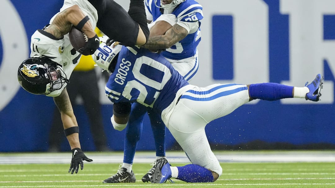 Dec 28, 2025; Indianapolis, Indiana, USA; Jacksonville Jaguars wide receiver Parker Washington (11) is brought down by Indianapolis Colts safety Nick Cross (20) and Indianapolis Colts cornerback Mekhi Blackmon (29) during a game at Lucas Oil Stadium. Mandatory Credit: Grace Hollars-USA TODAY Network via Imagn Images