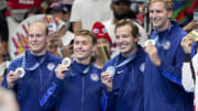 Jul 30, 2024; Nanterre, France; Luke Hobson (USA), Carson Foster (USA), Drew Kibler (USA) and Kieran Smith (USA) in the men’s 4 x 200-meter freestyle relay medal ceremony during the Paris 2024 Olympic Summer Games at Paris La Défense Arena. Mandatory Credit: Grace Hollars-USA TODAY Sports