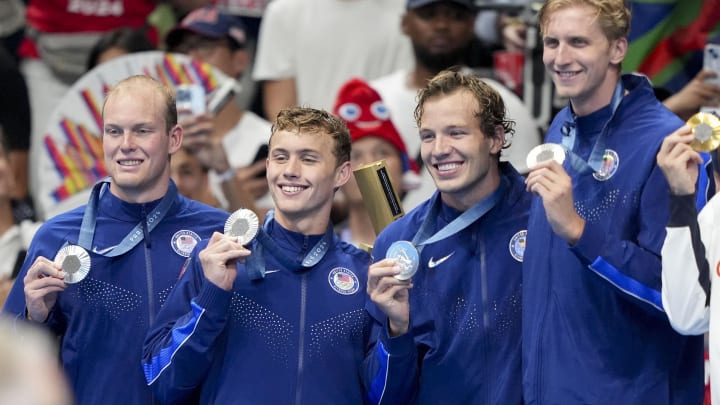 Jul 30, 2024; Nanterre, France; Luke Hobson (USA), Carson Foster (USA), Drew Kibler (USA) and Kieran Smith (USA) in the men’s 4 x 200-meter freestyle relay medal ceremony during the Paris 2024 Olympic Summer Games at Paris La Défense Arena. Mandatory Credit: Grace Hollars-USA TODAY Sports