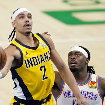 Indiana Pacers guard Andrew Nembhard (2) shoots the ball against Oklahoma City Thunder guard Luguentz Dort (5) during the third quarter in game one of the 2025 NBA Finals at Paycom Center. 