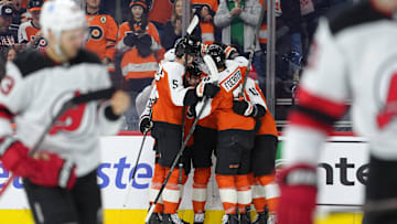 Philadelphia Flyers teammates celebrate after a goal. Mandatory Credit: Kyle Ross-Imagn Images