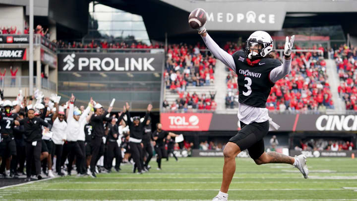 Cincinnati Bearcats wide receiver Evan Prater (3) scores on a two-point conversion from Cincinnati Bearcats quarterback Emory Jones (5) background, in the fourth quarter during a college football game between the Baylor Bears and the Cincinnati Bearcats, Saturday, Oct. 21, 2023, at Nippert Stadium in Cincinnati.