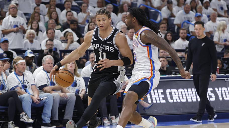 Spurs forward Carter Bryant drives against Thunder guard Cason Wallace during Game 5.