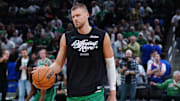 May 7, 2025; Boston, Massachusetts, USA; Boston Celtics center Kristaps Porzingis (8) warms up before the start of game two of the second round for the 2025 NBA Playoffs against the New York Knicks at TD Garden. Mandatory Credit: David Butler II-Imagn Images