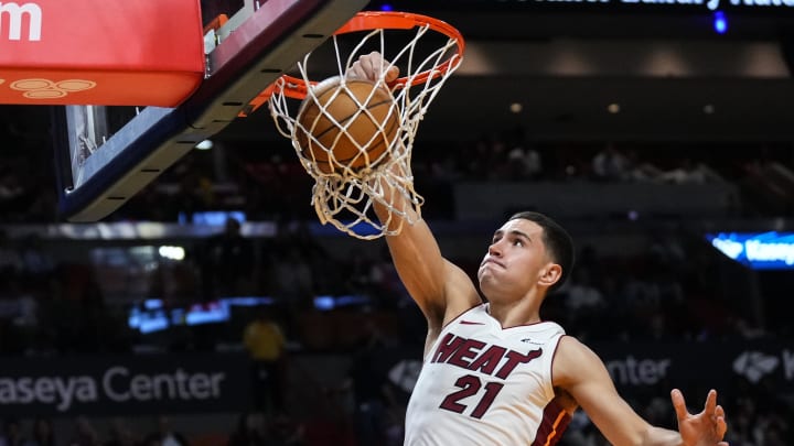 Oct 18, 2023; Miami, Florida, USA; Miami Heat forward Cole Swider (21) dunks the ball against the Brooklyn Nets during the second half at Kaseya Center. Mandatory Credit: Rich Storry-USA TODAY Sports