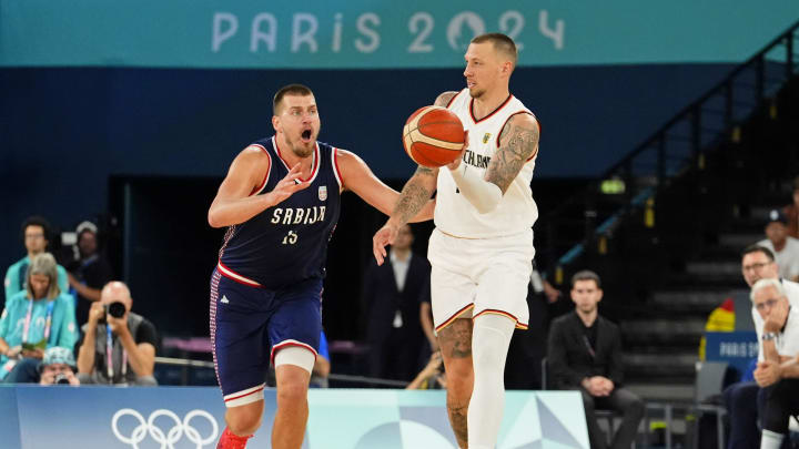 Aug 10, 2024; Paris, France; Germany power forward Daniel Theis (10) passes the ball against Serbia power forward Nikola Jokic (15) in the men's basketball bronze medal game during the Paris 2024 Olympic Summer Games at Accor Arena. 