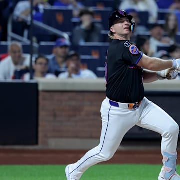 Sep 19, 2025; New York City, New York, USA; New York Mets first baseman Pete Alonso (20) follows through on a single against the Washington Nationals during the first inning at Citi Field. Mets shortstop Francisco Lindor (not pictured) scored on the play on an error by Nationals right fielder Dylan Crews (not pictured). Mandatory Credit: Brad Penner-Imagn Images