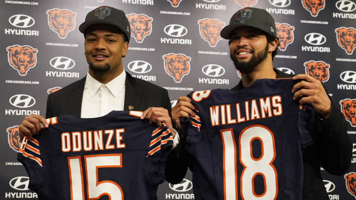 Apr 26, 2024; Lake Forest, IL, USA; Chicago Bears first round draft choices Rome Odunze (left) and Caleb Williams (right) pose for photos at a press conference at Halas Hall. Mandatory Credit: David Banks-USA TODAY Sports