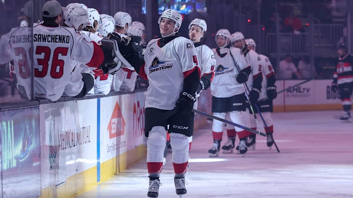 Cleveland Monsters defenseman and Blue Jackets prospect Corson Ceulemans celebrates a goal with his team. 