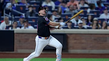 Sep 19, 2025; New York City, New York, USA; New York Mets first baseman Pete Alonso (20) follows through on a single against the Washington Nationals during the first inning at Citi Field. Mets shortstop Francisco Lindor (not pictured) scored on the play on an error by Nationals right fielder Dylan Crews (not pictured). Mandatory Credit: Brad Penner-Imagn Images