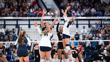 Penn State women's volleyball setter Izzy Starck  jumps up to set the ball