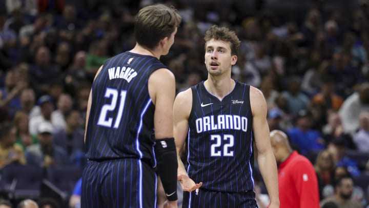 Orlando Magic center Moritz Wagner (21) speaks to forward Franz Wagner (22) during a break in play against the Washington Wizards in the second quarter at Amway Center. 