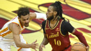 Nov 28, 2023; Cleveland, Ohio, USA; Cleveland Cavaliers guard Darius Garland (10) drives against Atlanta Hawks guard Trae Young (11) in the fourth quarter at Rocket Mortgage FieldHouse. Mandatory Credit: David Richard-USA TODAY Sports