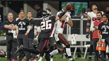 Jan 8, 2023; Atlanta, Georgia, USA; Atlanta Falcons cornerback Isaiah Oliver (26) deflects a pass in front of Tampa Bay Buccaneers wide receiver Scotty Miller (10) during the second  half at Mercedes-Benz Stadium. Mandatory Credit: Dale Zanine-Imagn Images