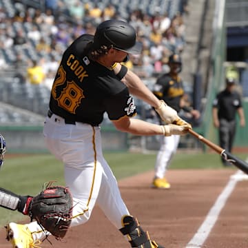 Sep 8, 2024; Pittsburgh, Pennsylvania, USA;  Pittsburgh Pirates first baseman Billy Cook (28) hits a two run double to record his first major league hit in his major league debut during the first inning against the Washington Nationals at PNC Park. Mandatory Credit: Charles LeClaire-Imagn Images