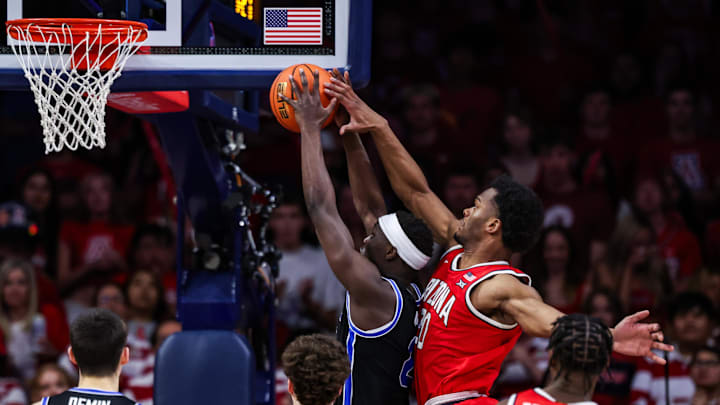 Feb 22, 2025; Tucson, Arizona, USA; Arizona Wildcats forward Tobe Awaka (30) attempts to block BYU Cougars forward Kanon Catching (6) from a basket during the second half at McKale Center. Mandatory Credit: Aryanna Frank-Imagn Images