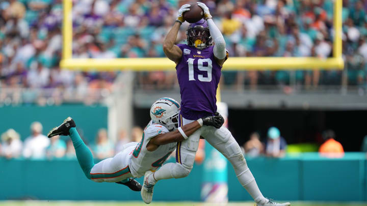Miami Dolphins cornerback Nik Needham (40) makes a tackle on Minnesota Vikings wide receiver Adam Thielen (19) during the first half of an NFL game. Needham left the game after the play with a leg injury. Hard Rock Stadium, Miami Gardens, Oct. 16, 2022.