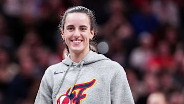 Indiana Fever Caitlin Clark (22) smiles Saturday, May 3, 2025, during a timeout at a preseason game between the Indiana Fever and the Washington Mystics at Gainbridge Fieldhouse in Indianapolis.