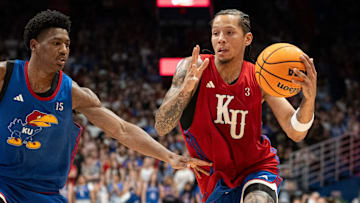 Kansas men's basketball's Tre White (3) drives to the basket during Late Night in the Phog, Friday, Oct. 17, 2025 at Allen Fieldhouse .