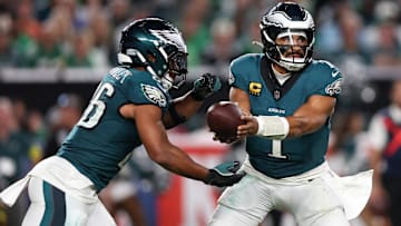 Sep 4, 2025; Philadelphia, Pennsylvania, USA; Philadelphia Eagles quarterback Jalen Hurts (1) hands off the ball to running back Saquon Barkley (26) during the third quarter of the game against the Dallas Cowboys at Lincoln Financial Field. 