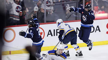 Apr 7, 2025; Winnipeg, Manitoba, CAN; Winnipeg Jets left wing Alex Iafallo (9) celebrates a goal against the St. Louis Blues with Winnipeg Jets center Mark Scheifele (55) in the third period at Canada Life Centre. Mandatory Credit: James Carey Lauder-Imagn Images