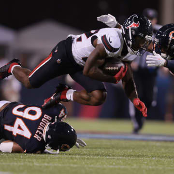 Austin Booker misses on the tackle attempt as Jamree Kromah closes in from the side to make it in the Bears' 21-17 win.