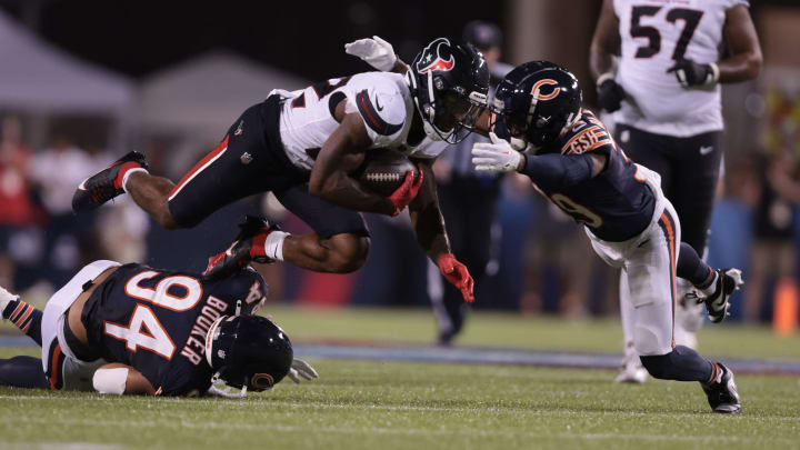 Austin Booker misses on the tackle attempt as Jamree Kromah closes in from the side to make it in the Bears' 21-17 win.