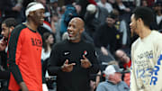Apr 13, 2025; Portland, Oregon, USA;  Portland Trail Blazers head coach Chauncey Billups (middle) shares a moment with Portland Trail Blazers center Duop Reath (26) (left) and Portland Trail Blazers guard Anfernee Simons (1) before the Portland Trail Blazers play Los Angeles Lakers at Moda Center. Mandatory Credit: Jaime Valdez-Imagn Images