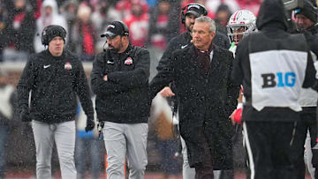 Former head coach Urban Meyer congratulates Ohio State Buckeyes head coach Ryan Day in the final moments of the NCAA football game at Michigan Stadium in Ann Arbor, Mich. on Nov. 29, 2025. Ohio State won 27-9.