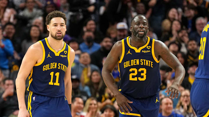 Jan 27, 2024; San Francisco, California, USA; Golden State Warriors guard Klay Thompson (11) and forward Draymond Green (23) during the third quarter against the Los Angeles Lakers at Chase Center.