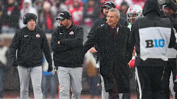 Former head coach Urban Meyer congratulates Ohio State Buckeyes head coach Ryan Day in the final moments of the NCAA football game at Michigan Stadium in Ann Arbor, Mich. on Nov. 29, 2025. Ohio State won 27-9.