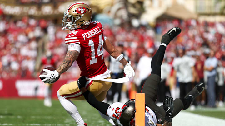 Nov 10, 2024; Tampa, Florida, USA; San Francisco 49ers wide receiver Ricky Pearsall (14) score a touchdown past Tampa Bay Buccaneers safety Antoine Winfield Jr. (31) in the first quarter at Raymond James Stadium. Mandatory Credit: Nathan Ray Seebeck-Imagn Images
