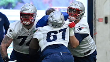 May 9, 2025; Foxborough, MA, USA; New England Patriots guard Jack Conley (74) and tackle Will Campbell (66) do a drill against tackle Devonte Gordon (67) during rookie camp at Gillette Stadium. Mandatory Credit: Eric Canha-Imagn Images