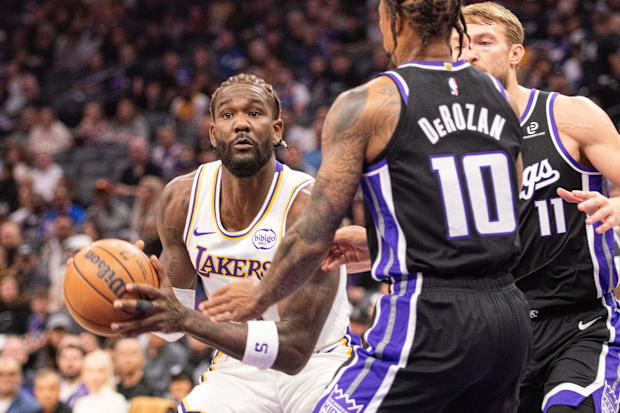 Lakers center Deandre Ayton looks to pass the ball during the first quarter against the Kings.