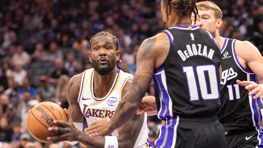 Lakers center Deandre Ayton looks to pass the ball during the first quarter against the Kings.