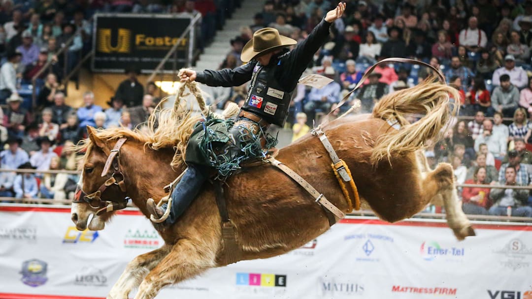 Zeke Thurston rides a bronc during finals of the San Angelo Stock Show 