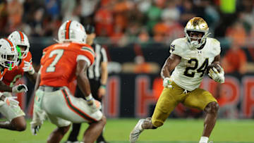 Aug 31, 2025; Miami Gardens, Florida, USA; Notre Dame Fighting Irish running back Jadarian Price (24) rushes the ball against the Miami Hurricanes during the second quarter at Hard Rock Stadium. Mandatory Credit: Sam Navarro-Imagn Images