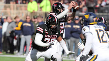 Nov 30, 2024; Lubbock, Texas, USA; Texas Tech Red Raiders offensive lineman Caleb Rogers (76) blocks against the West Virginia Mountaineers in the second half at Jones AT&T Stadium and Cody Campbell Field. Mandatory Credit: Michael C. Johnson-Imagn Images
