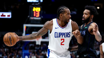 Dec 20, 2023; Dallas, Texas, USA;  LA Clippers forward Kawhi Leonard (2) controls the ball as Dallas Mavericks forward Derrick Jones Jr. (55) defends during the second half at American Airlines Center. Mandatory Credit: Kevin Jairaj-USA TODAY Sports