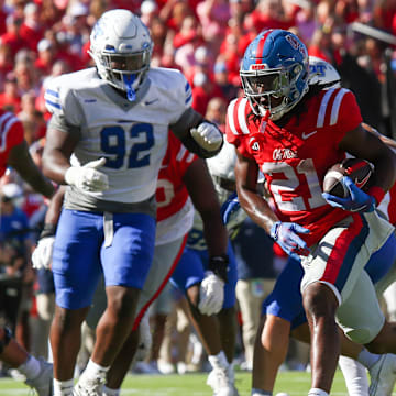 Sep 7, 2024; Oxford, Mississippi, USA; Mississippi Rebels running back Henry Parrish Jr. (21) runs the ball for a touchdown during the first half against the Middle Tennessee Blue Raiders at Vaught-Hemingway Stadium. Mandatory Credit: Petre Thomas-Imagn Images