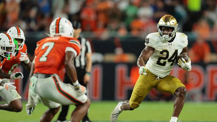 Aug 31, 2025; Miami Gardens, Florida, USA; Notre Dame Fighting Irish running back Jadarian Price (24) rushes the ball against the Miami Hurricanes during the second quarter at Hard Rock Stadium. Mandatory Credit: Sam Navarro-Imagn Images